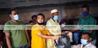 আত্রাইয়ে ধান কাটা শ্রমিকদের গ্রহণ ও খাবার পরিবেশন